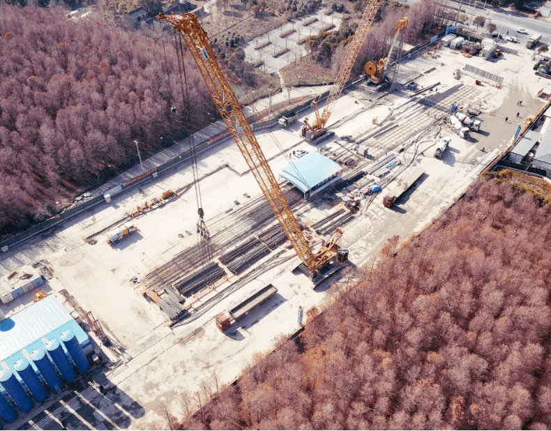 XCMG crawler crane lifting heavy loads at a construction site